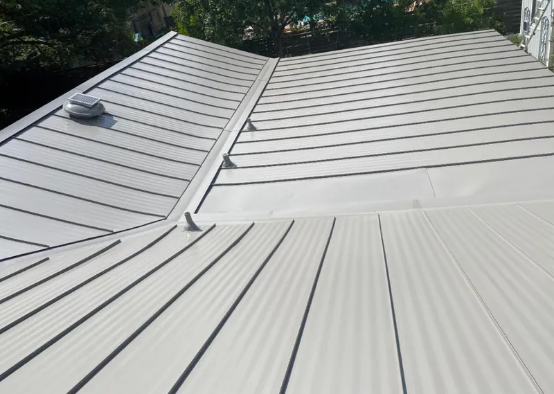 Solar attic fan installed on a metal roof for Roof Ventilation in Dothan